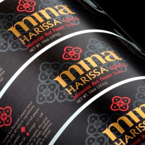 Custom hot sauce labels of Mina Harissa with custom gold foil stamp and gloss Spot UV