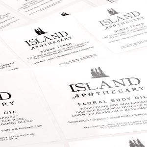 white custom lotion labels printed with black Island Apothecary label artwork