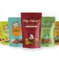 Custom pet treat bags in a rainbow of colors packaging cat kibble and dog treats