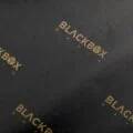 17gsm black custom printed tissue paper with Blackbox Mafia logo print in gold ink