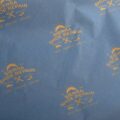 17gsm custom royal blue tissue paper with Sierra Shoe Repair logo pattern printed in gold ink