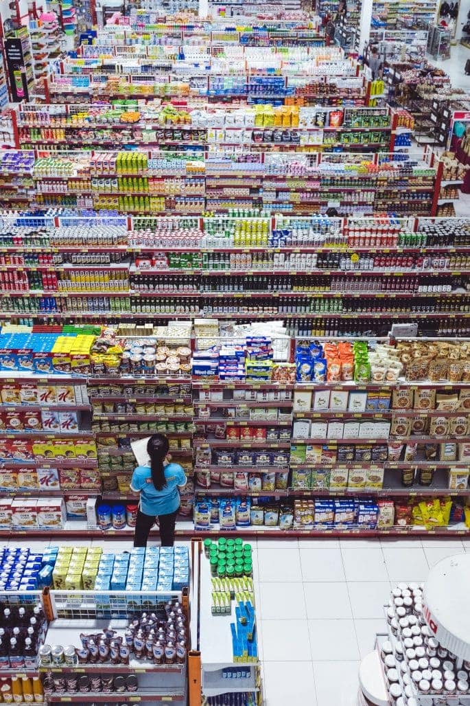 How to Label Your Products for Market Success - Woman taking notes in supermarket