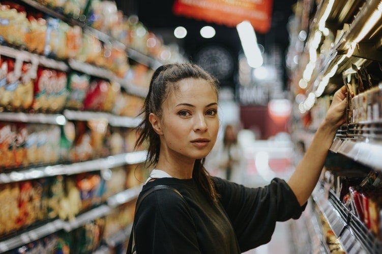 Female shopper looking at camera