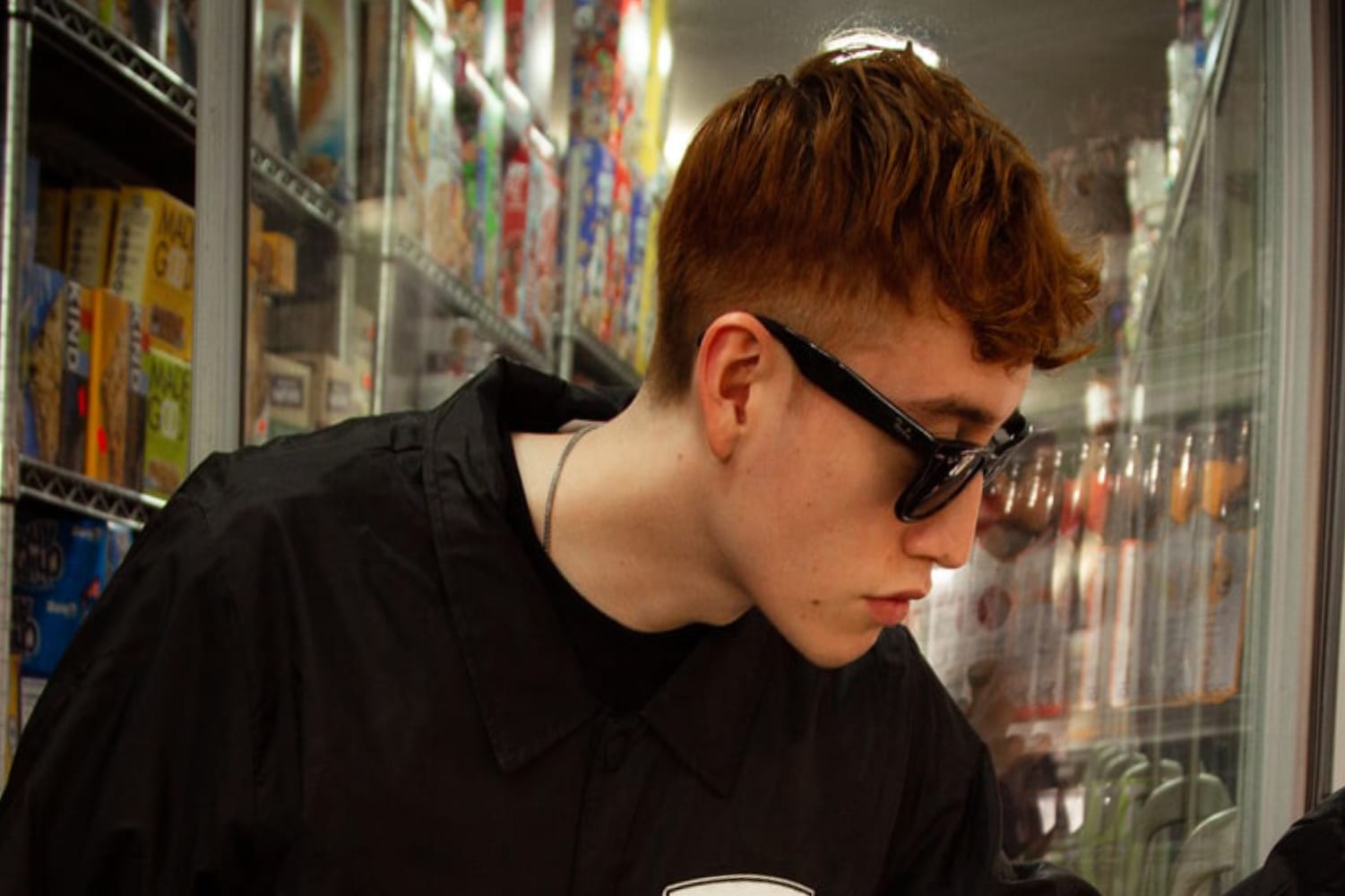 Man looking at products in a convenience store