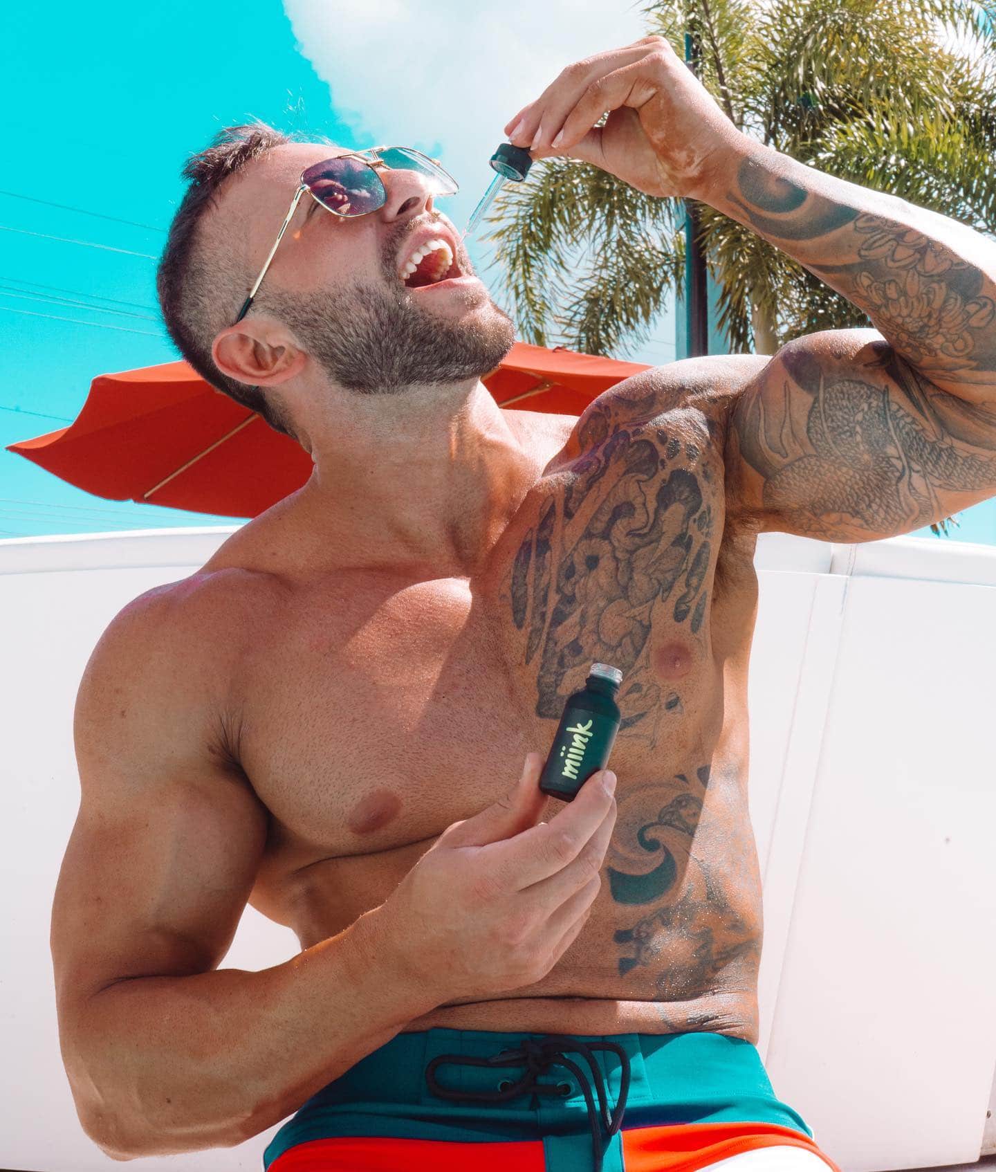 Man taking Miink Mint CBD Tincture