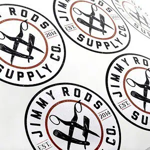 Custom printed die cut labels on a roll liner, black and rust ink on white semigloss paper